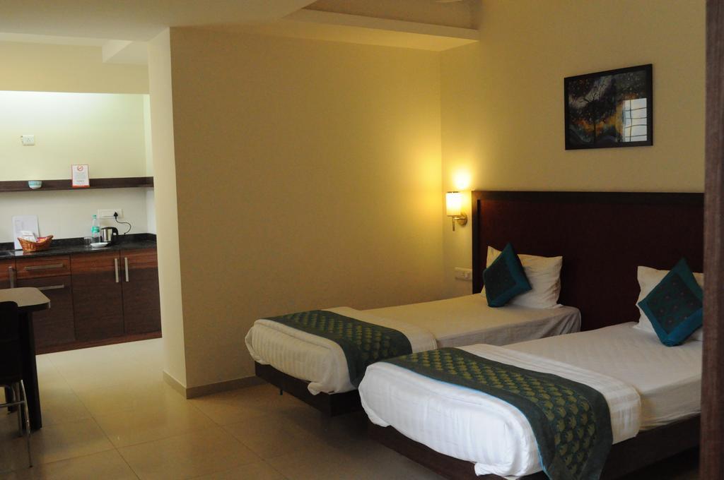 Ixora Suites Bangalore Oda fotoğraf