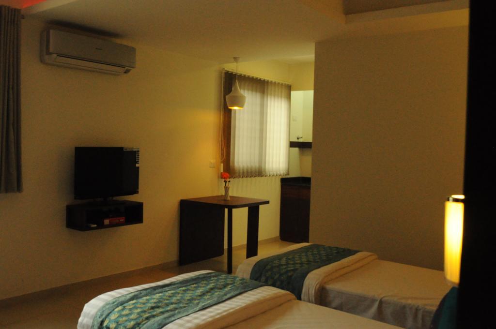Ixora Suites Bangalore Oda fotoğraf