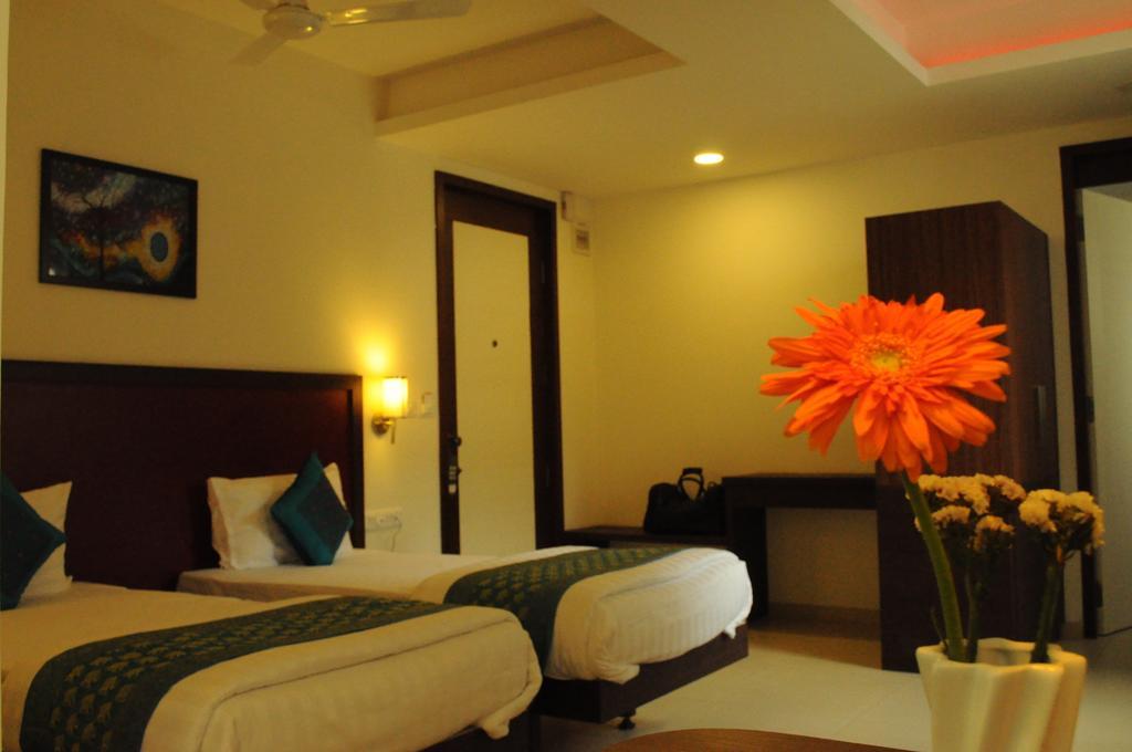 Ixora Suites Bangalore Oda fotoğraf