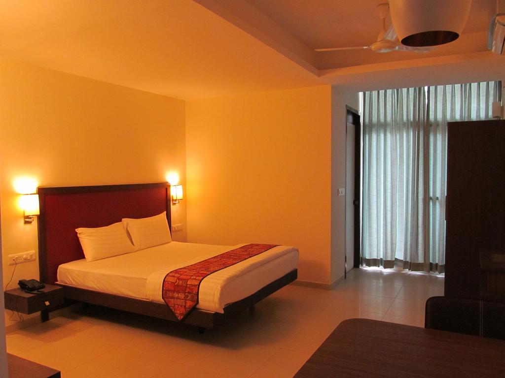 Ixora Suites Bangalore Oda fotoğraf