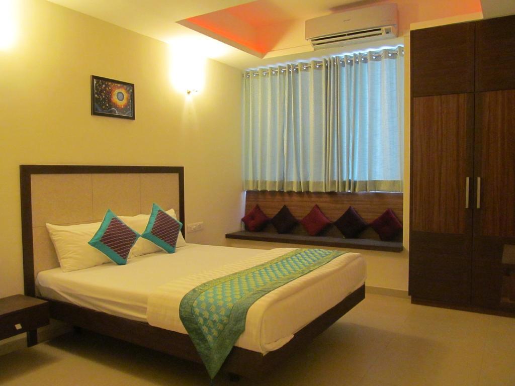 Ixora Suites Bangalore Oda fotoğraf