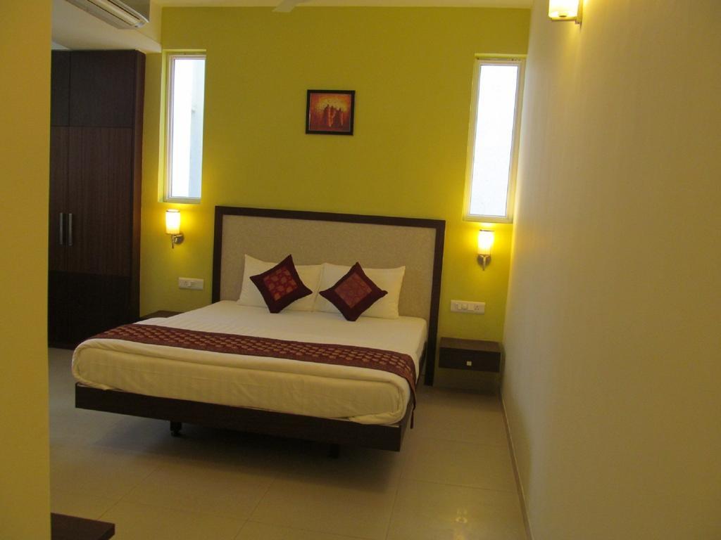 Ixora Suites Bangalore Oda fotoğraf
